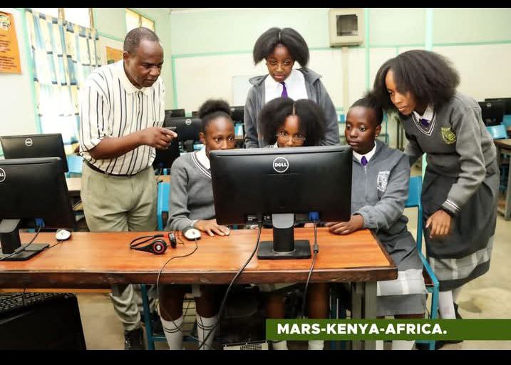 Booker Academy students in the computer lab with a teacher